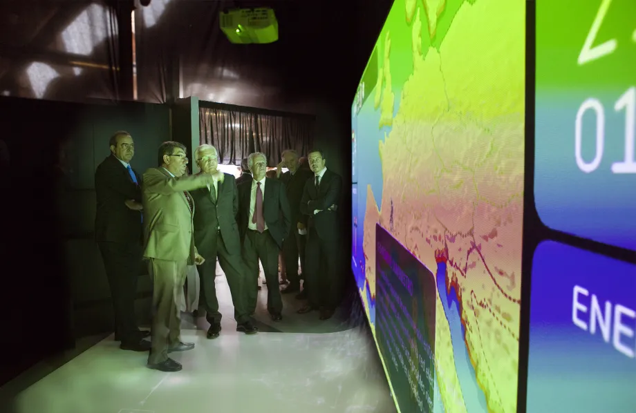 Officials during the opening of the exhibit inside the module with the electrical interconnections game.